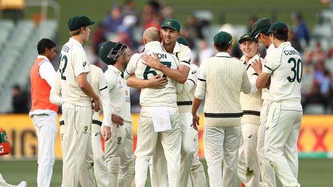 Somewhere in that huddle is the answer to question 24 Picture: AFP