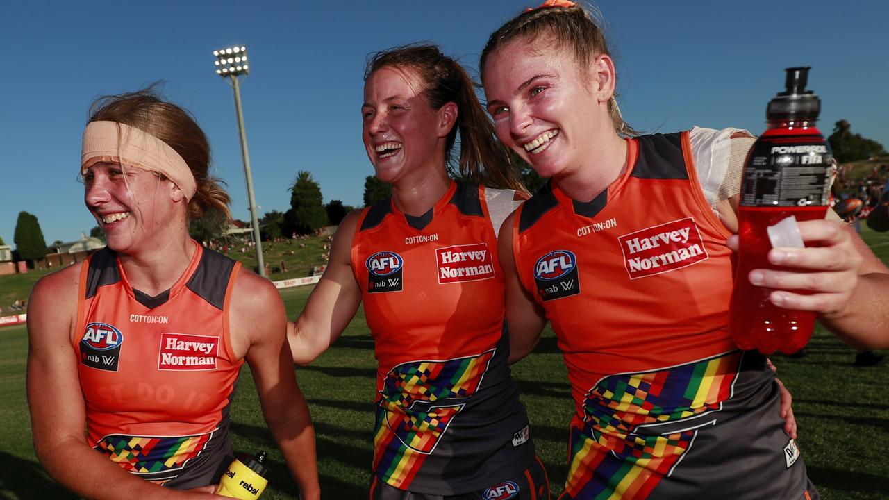 Katherine Smith, Nicola Barr and Lisa Steane of the Giants celebrate during the 2022 AFLW.