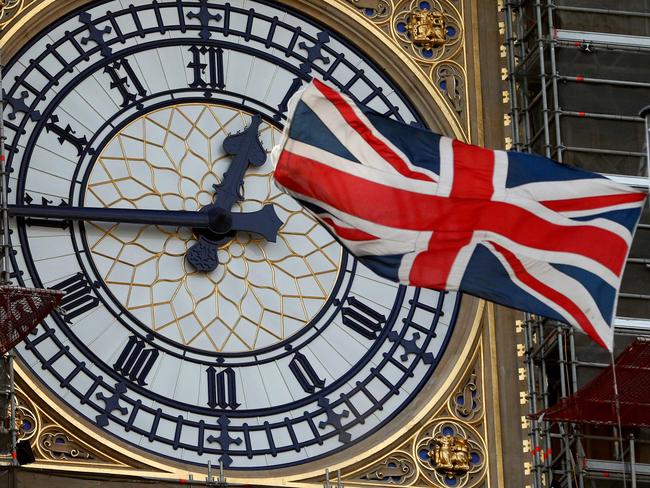 The Union flag flutters near the clock face of Big Ben during ongoing renovations to the Tower and the Houses of Parliament, in central London. Picture: Adrian Dennis/AFP