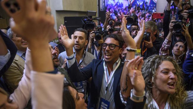 Brothers of Italy supporters celebrate in Rome on Monday. Picture: Getty Images