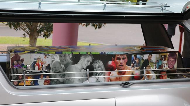 Troy Water’s coffin covered in photos. (AAP Image/Mark Scott)