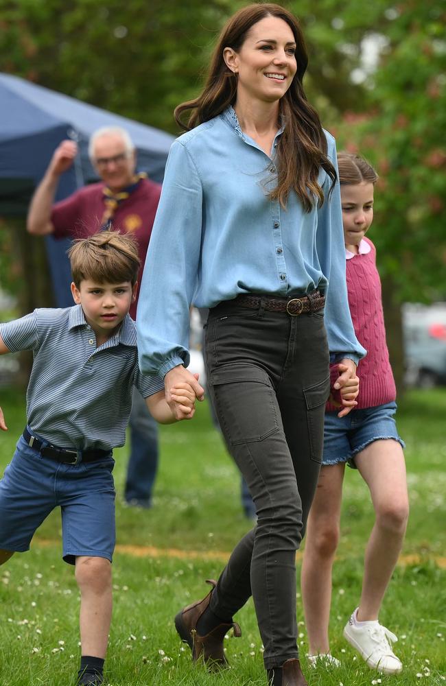 May 8: In mum mode with her hands full alongside Prince Louis and Princess Charlotte, the Princess of Wales wore a blue blouse with jeans and boots. Picture: Daniel Leal - WPA Pool/Getty Images
