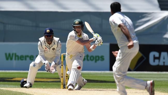 Smith plays a reverse sweep off the bowling of Ashwin in 2014.