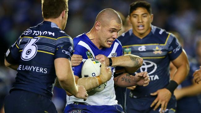 David Klemmer of the Bulldogs is tackled.
