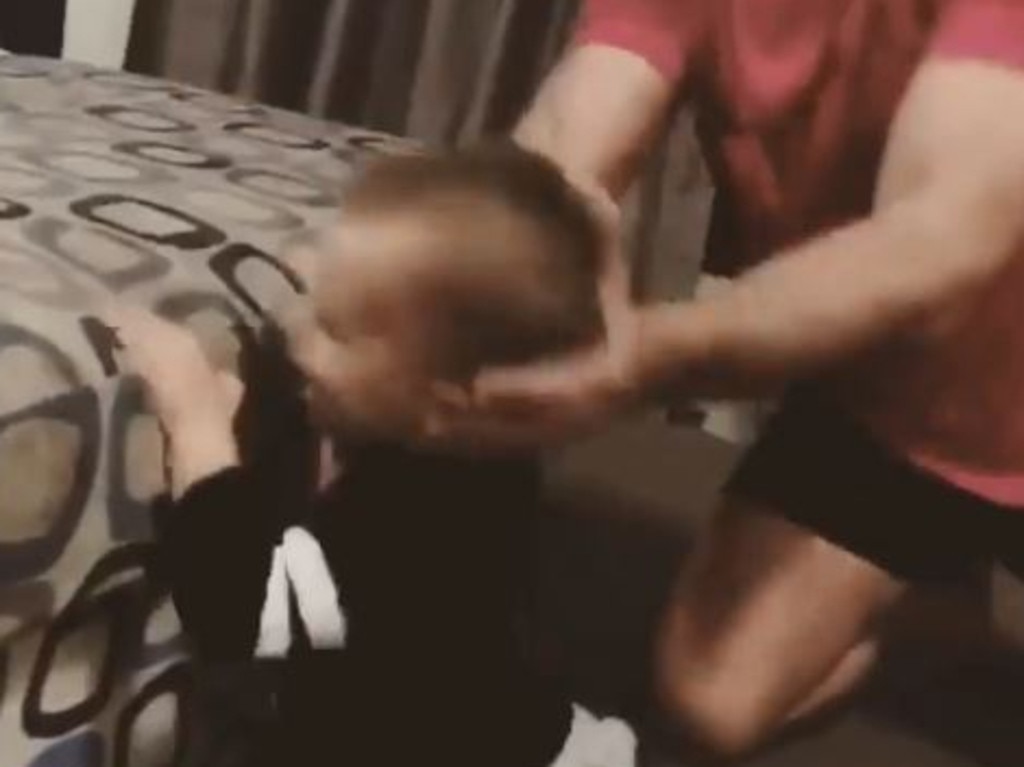He smashes the boy into an ottoman at one point.