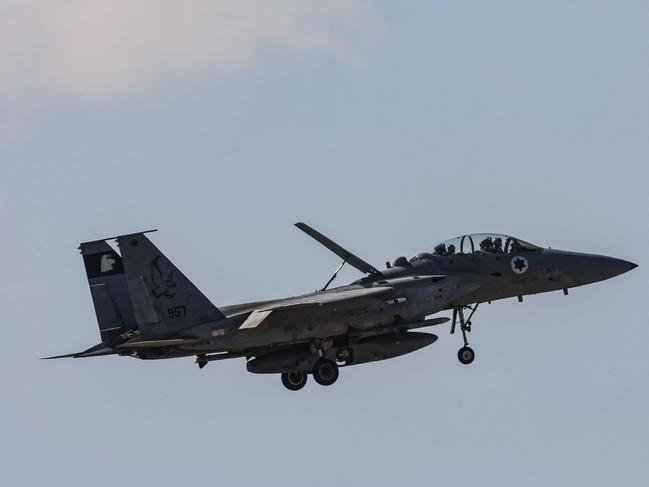 TOPSHOT - An Israeli fighter jet returning to base flies above an area near Tel Aviv on September 26, 2024. Israel's defence ministry said on September 26 that it had secured an $8.7 billion aid package from the United States to support the country's ongoing military efforts, including upgrading air defence systems. (Photo by GIL COHEN-MAGEN / AFP)