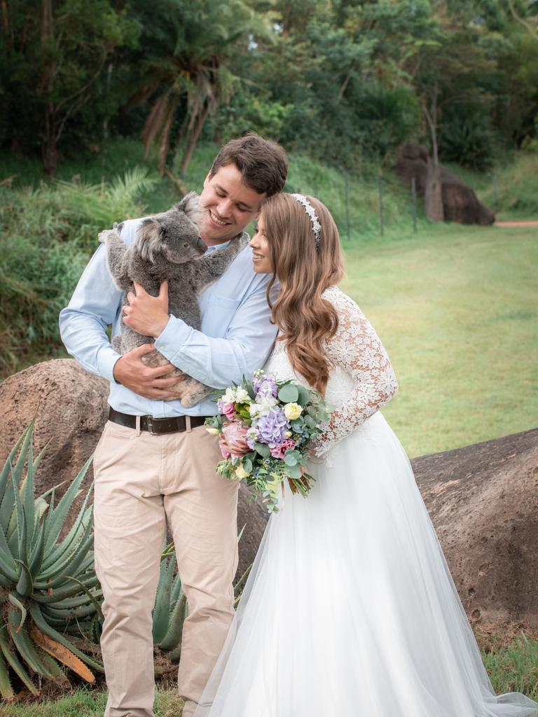 Chandler Powell and Bindi Irwin on their wedding day with a koala. Picture: Kate Berry