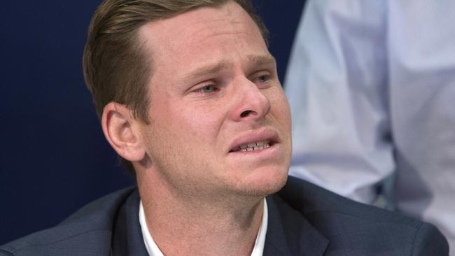 Former Australian cricket captain Steve Smith grimaces as he speaks to the media — and Intern Pete.