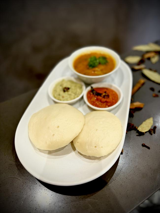 Idli with coconut and tomato chutneys and lentil sambar at The Logical Indian.