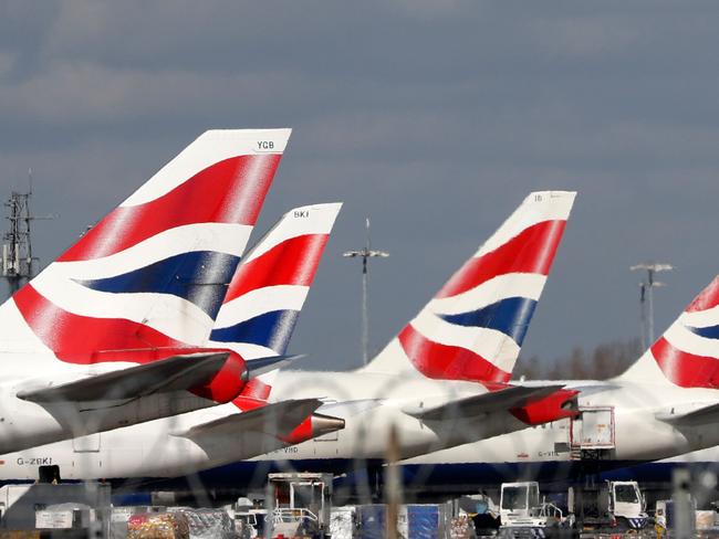 (FILES) In this file photo taken on March 16, 2020 This picture shows British Airways planes grounded at Heathrow's airport terminal 5, in west London. - The British government has for the time cooled expectations on a rescue plan for the air sector whose activity is almost stopped due to the coronavirus pandemic. The state announced on March 25, 2020, that it would only come to the aid of airlines or airports if "all other options are exhausted, Minister of Finance Rishi Sunak in a letter sent to the sector. (Photo by Adrian DENNIS / AFP)