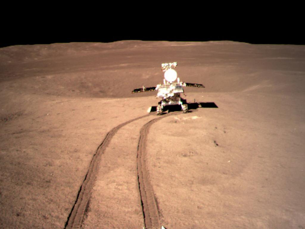 Chang'e-4's rover, Yutu-2, moves across the lunar surface after leaving the main landing craft. CREDIT: CNSA/CLAP.