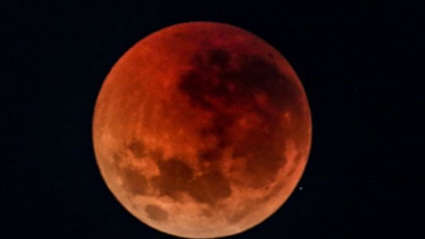 The blood moon over Sydney, Australia today. Picture: Nicholas Eager