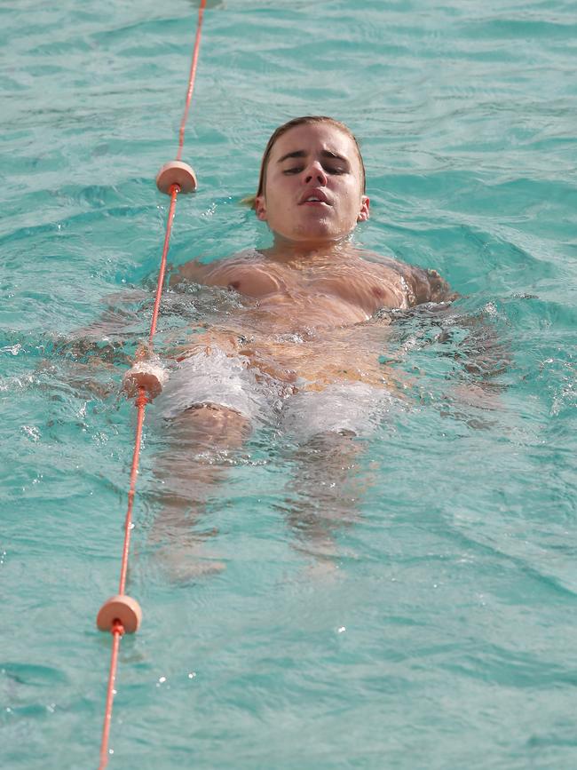 Justin Bieber spotted swimming at Bondi Iceberg in Sydney. Picture: KHAPGG/Matrix