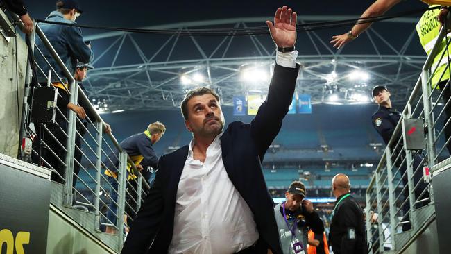 Postecoglou waves to the crowd after the Socceroos defeated Honduras to earn World Cup qualification. Picture: Phil Hillyard