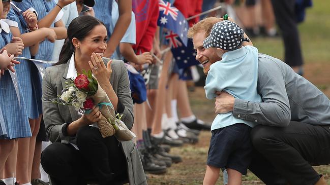 Meghan, Duchess of Sussex and Prince Harry, Duke of Sussex delighted onlookers when they embraced a little boy during their visit Dubbo earlier this year. Picture: Cameron Spencer/Getty