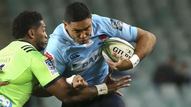 The Waratahs’ Curtis Rona tries to bust through the Highlanders defence.