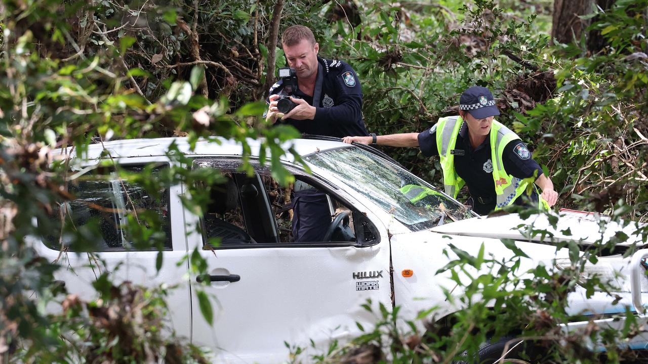 Police investigate the death of Peter Wells after his car was washed off the road by flood waters, Greenbank. Picture: NCA NewsWire/ Liam Kidston