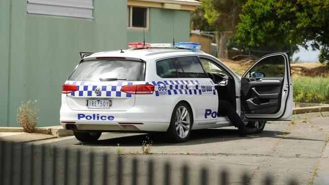 Police guard the scene of a fire at the former Oberon High School site. Picture: Alison Wynd