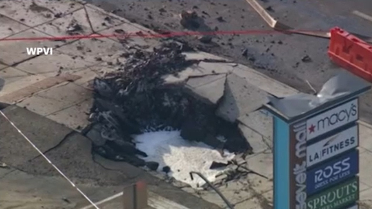 The medical plane crashed into a busy Philadelphia neighbourhood on Friday killing all six people on board and one person on the ground. Picture: CNN (via WPVI)