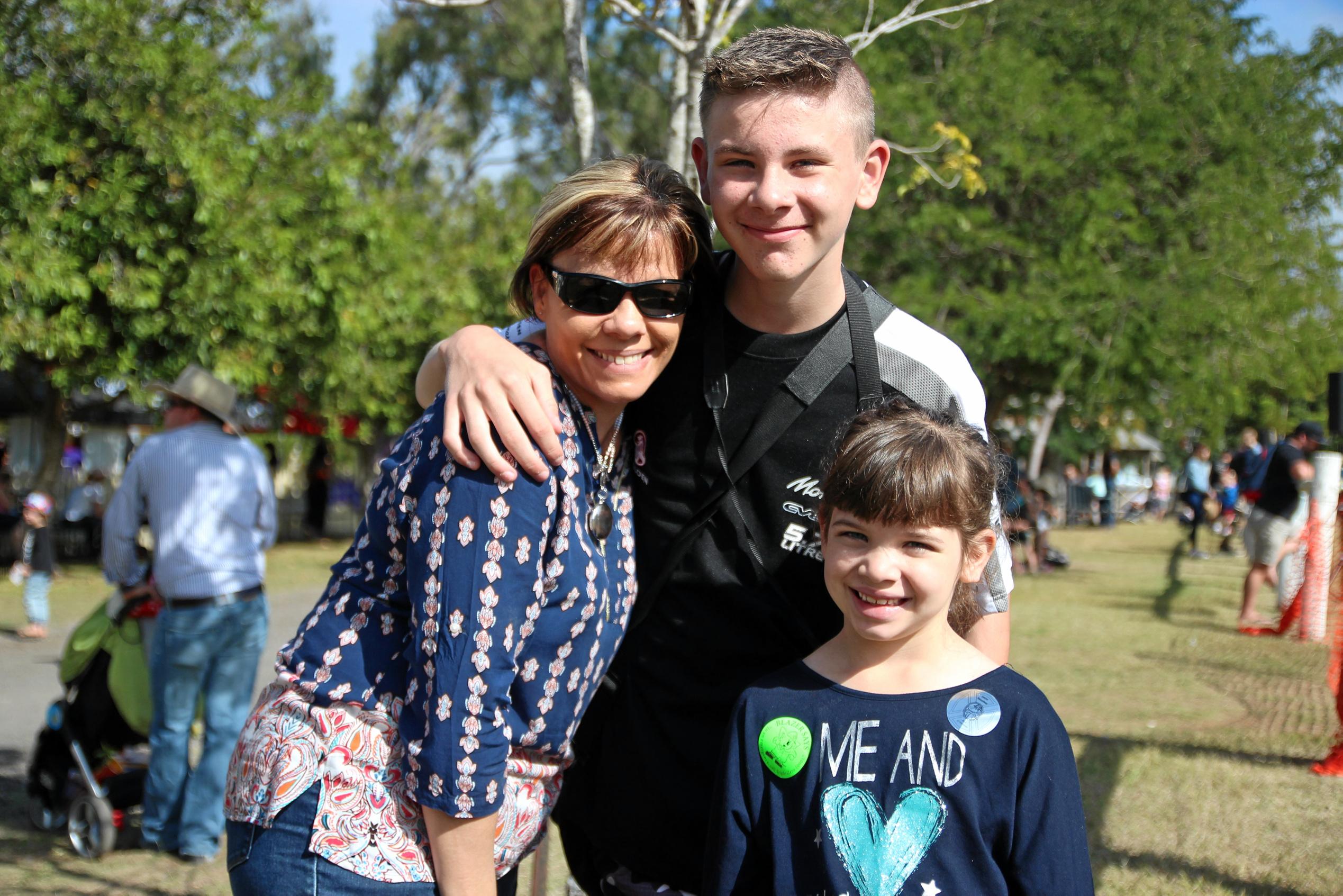 Tanya Bowman, Jaxon White and Riarna White watching the demonstrations at the Emergency Services Day in Rockhampton. Picture: Shayla Bulloch