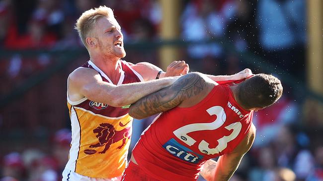 Nick Robertson throws a jumper punch during a scuffle with Lance Franklin. Picture: Phil Hillyard