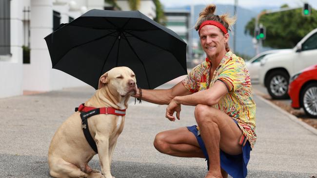 Jack Wilson made sure he carried an umbrella into town for his best mate Bull in case of any rain. Picture: Brendan Radke