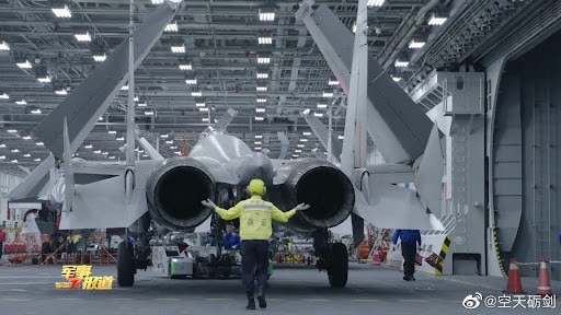 A Chinese naval combat jet, the J-15 “Flying Shark” within the hangar of the aircraft carrier PLAN Shandong. Source: China MoD/social media