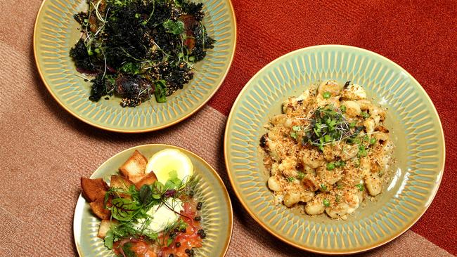 Maggie May’s Charred Green Power Bowl, Gnocchi and Gin Cured Salmon (front). Picture: David Clark