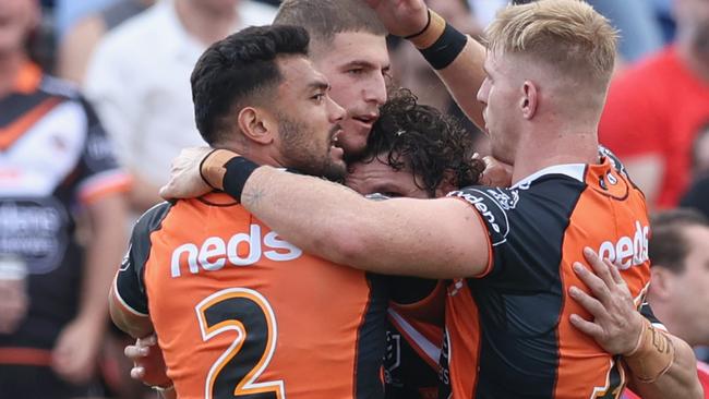 NEWCASTLE, AUSTRALIA - MARCH 28: Wests Tigers celebrate a try from Adam Doueihi during the round three NRL match between the Newcastle Knights and the Wests Tigers at McDonald Jones Stadium on March 28, 2021, in Newcastle, Australia. (Photo by Ashley Feder/Getty Images)