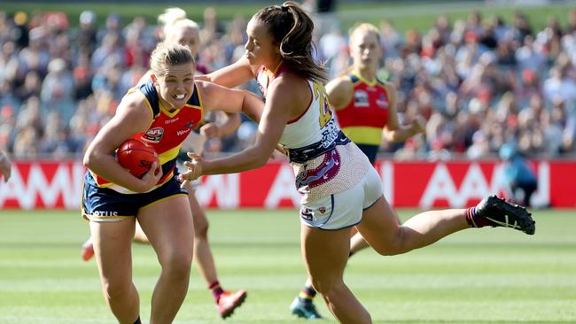 Chloe Scheer attempts to break a tackle during the grand final. Picture: James Elsby/AFL Photos via Getty Images