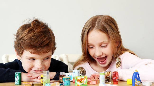 Billy Keating and Ava Keating with the Coles Mini Collectables. Picture: Tim Hunter.