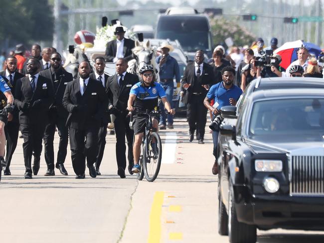 The remains of George Floyd are brought by horse-drawn carriage in a funeral procession to Houston Memorial Gardens Cemetery for burial in Pearland, Texas. Picture: AFP