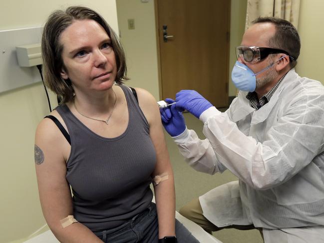 Jennifer Haller gets the first shot in the clinical trial of a potential vaccine for COVID-19. Picture: Ted S. Warren/AP