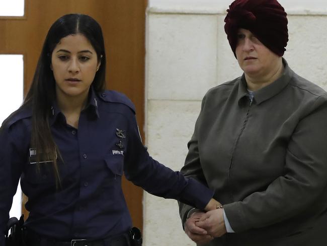 Malka Leifer, a former Australian teacher accused of dozens of cases of sexual abuse of girls at a school, arrives for a hearing at the District Court in Jerusalem on February 27, 2018, - Israel on February 12 arrested the Australian woman who is wanted in her home country on child sex abuse charges, police announced. The suspect has been living in a West Bank settlement for the past decade following a complaint filed against her by a former student at a Jewish ultra-Orthodox school she ran in Melbourne. (Photo by AHMAD GHARABLI / AFP)