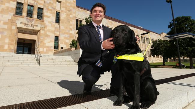 Paul Harpur, pictured with his guide dog Sean, has been blind since he was 14.