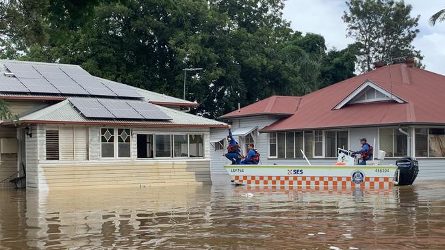 State Emergency Service crews inspect homes on Ewing Street at Lismore. Picture: Stuart Cumming