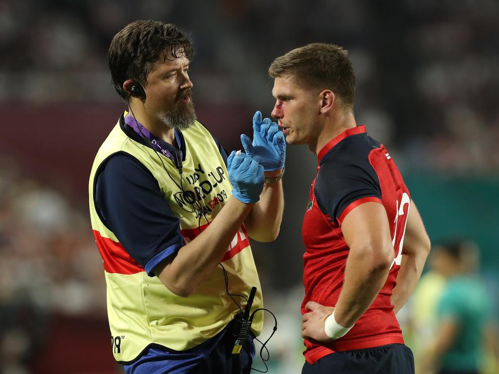 Owen Farrell receives attention from team doctor Rob Young. (Photo by David Rogers/Getty Images)