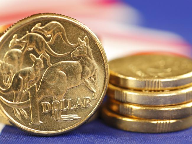 Australian coins sitting on an Australian flag. money coins dollars generic