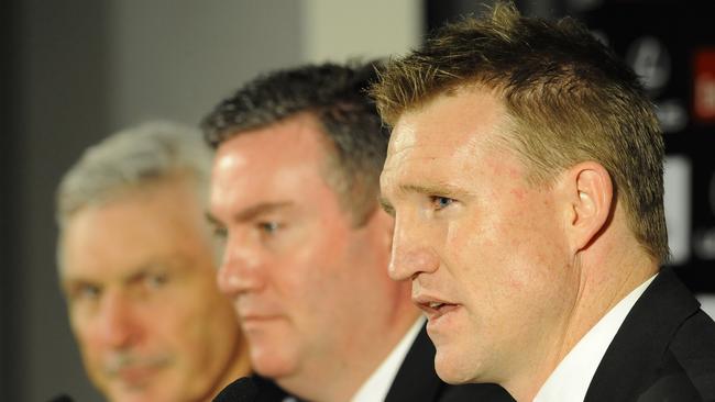 Former Collingwood captain Nathan Buckley (right) speaks to the media as club president Eddie McGuire and coach Mick Malthouse (left) announce the club’s succession plan. Picture: AAP Image/Julian Smith.