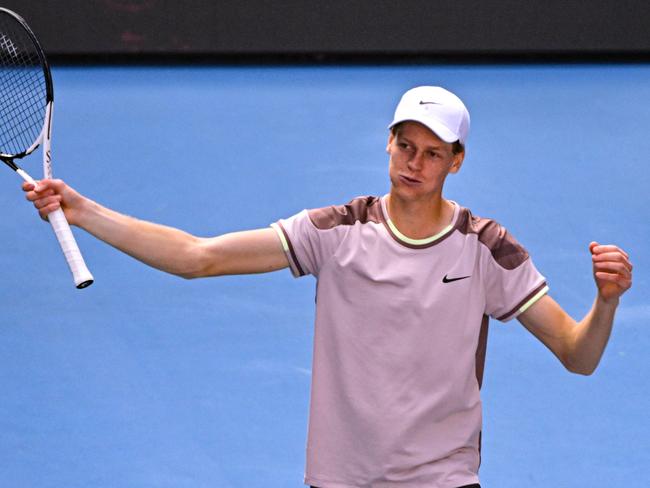 Italy's Jannik Sinner celebrates victory against Serbia's Novak Djokovic during their men's singles semi-final match on day 13 of the Australian Open tennis tournament in Melbourne on January 26, 2024. (Photo by WILLIAM WEST / AFP) / -- IMAGE RESTRICTED TO EDITORIAL USE - STRICTLY NO COMMERCIAL USE --