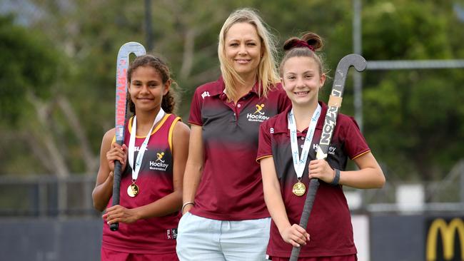 Winners of the Under 13 Australian Hockey Carnival, Cinders players Heidi Talbot, 12, and Bree Pendrigh, 12, with Queensland under-13 Cinders head coach Kylie McArthur. PICTURE: ANNA ROGERS