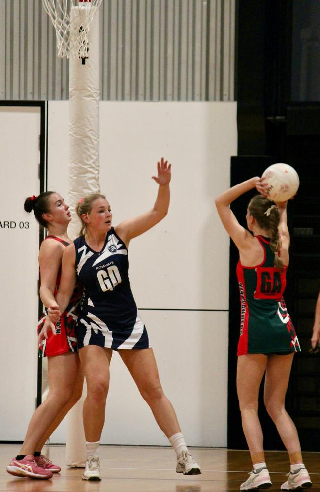 Highlanders GA Grace Bowman takes a shot during the semi-final of Townsville's Premier League netball, 2023. Picture: Shaantel Hampson / TCNAI.