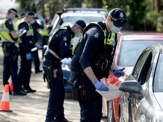 MELBOURNE, AUSTRALIA - NewsWire Photos AUGUST 11, 2020: Police check travel permits at a mobile checkpoint at Eltham in Melbourne's outer north east as stage 4 lockdowns come into effect across the city. Picture: NCA NewsWire / Andrew Henshaw