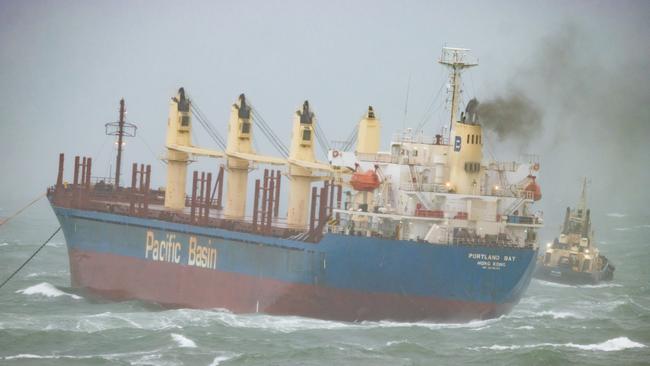 Three tug boats are taking the ship back out to sea, away from the dangerous of crashing near the Royal National Park. Picture: Mark Sundin