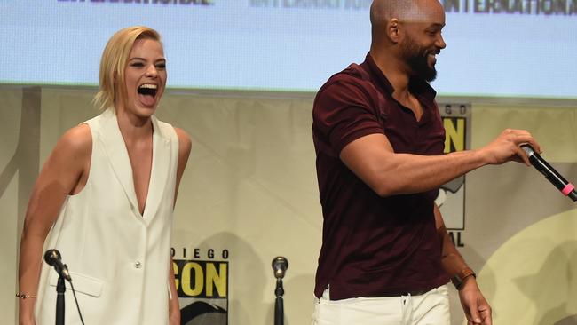 Vest dressed ... Margot Robbie and Suicide Squad co-star Will Smith at a presentation for the movie at Comic-Con. Picture: Kevin Winter/Getty Images