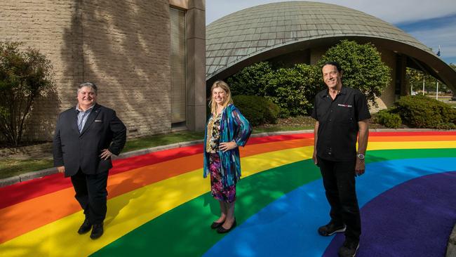 Hobsons Bay councillors Tony Briffa and Diana Grima with Tony Mead from Industrial Art Sign Co on the ‘rainbow road’. Picture: Hobsons Bay Council