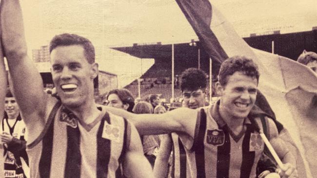 Sandringham  VFL premiership player Adrian Mackenzie, diagnosed with CTE in 2021 after a long footballing career >Adrian carrying the flag on the right .