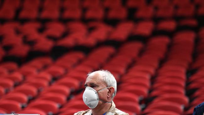 Australian Associated Press journalist Adrian Warren wears a face mask during Game 3 of the NBL Finals match between Sydney Kings and Perth Wildcats at Qudos Bank Arena on Sunday. Picture: AAP