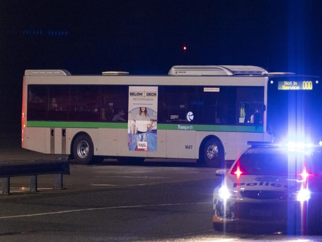 A bus transports the first group of evacuees from Afghanistan on the tarmac at Perth Airport. Picture: Getty Images