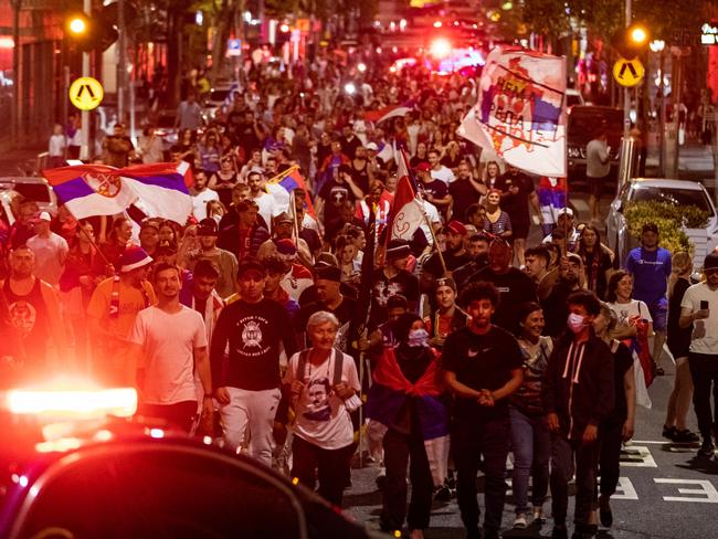 Serbian tennis fans march along Collins Street in Melbourne, Australia. Picture: Getty Images